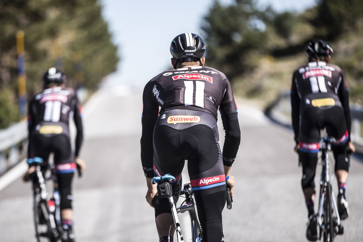 A view of riders from the back