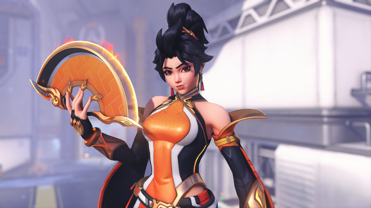 An in-game screenshot of an Overwatch hero. A young woman wearing a black and orange outfit holds a fan in her hand and looks towards the viewer.