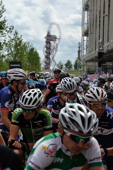 The peloton lines up on the starting line in the Olympic park.
