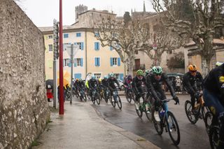 The pack of riders cycles during the 6th stage of the Paris-Nice cycling race, 209,8 km between Saint-Julien-en-Saint-Alban and Berre lâ€™Ã‰tang, on March 14, 2025. (Photo by Anne-Christine POUJOULAT / AFP)