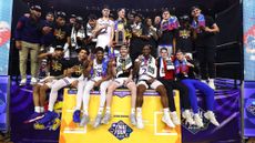 The Kansas Jayhawks pose for a photo after winning the 2022 NCAA men's basketball tournament.