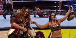 Nia Jax and Shayna Baszler after defending their titles at WrestleMania 37