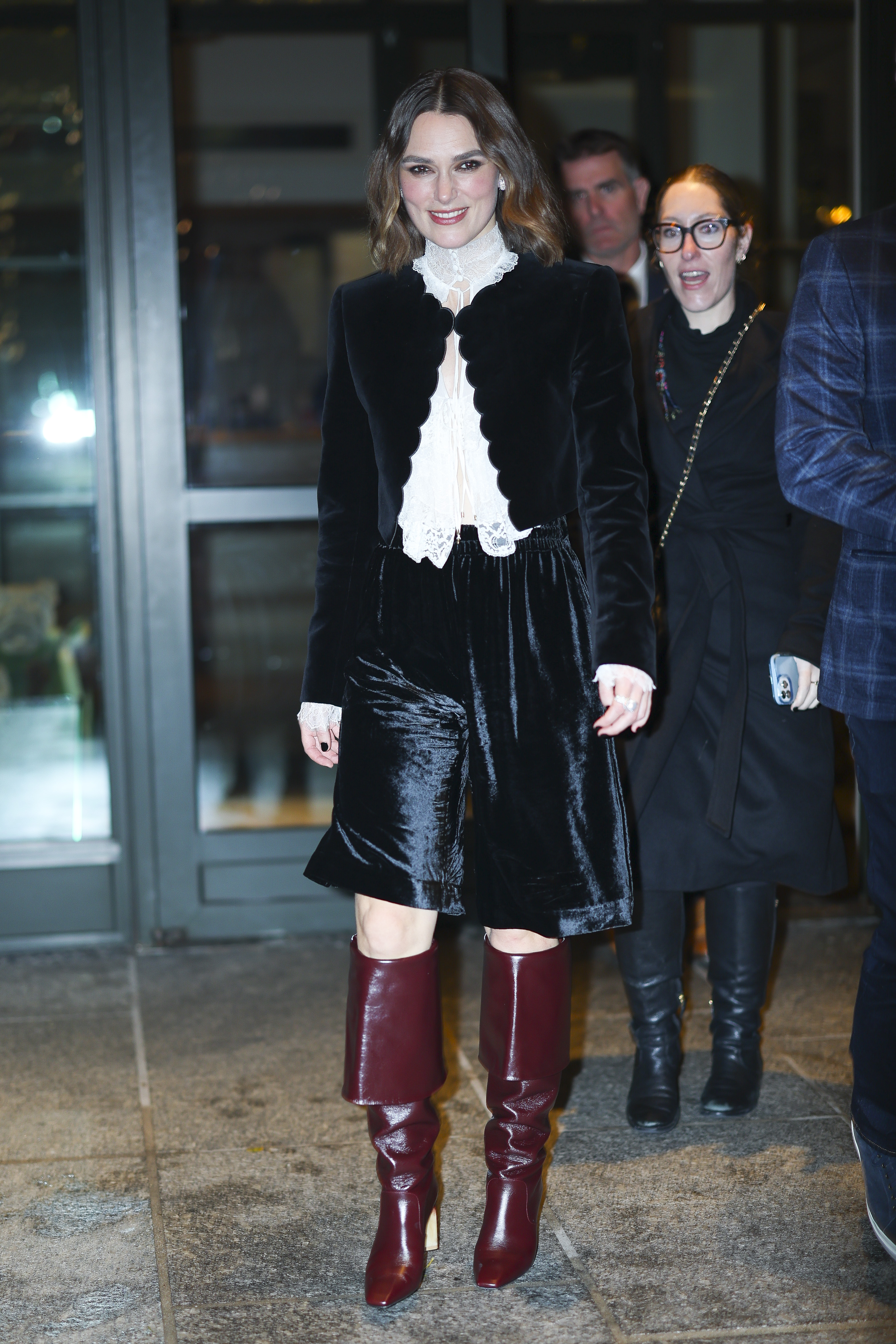 Keira Knightley wearing burgundy shoes.