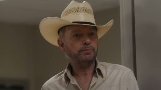 Billy Bob Thornton as Tommy looking forward wearing a crooked cowboy hat.