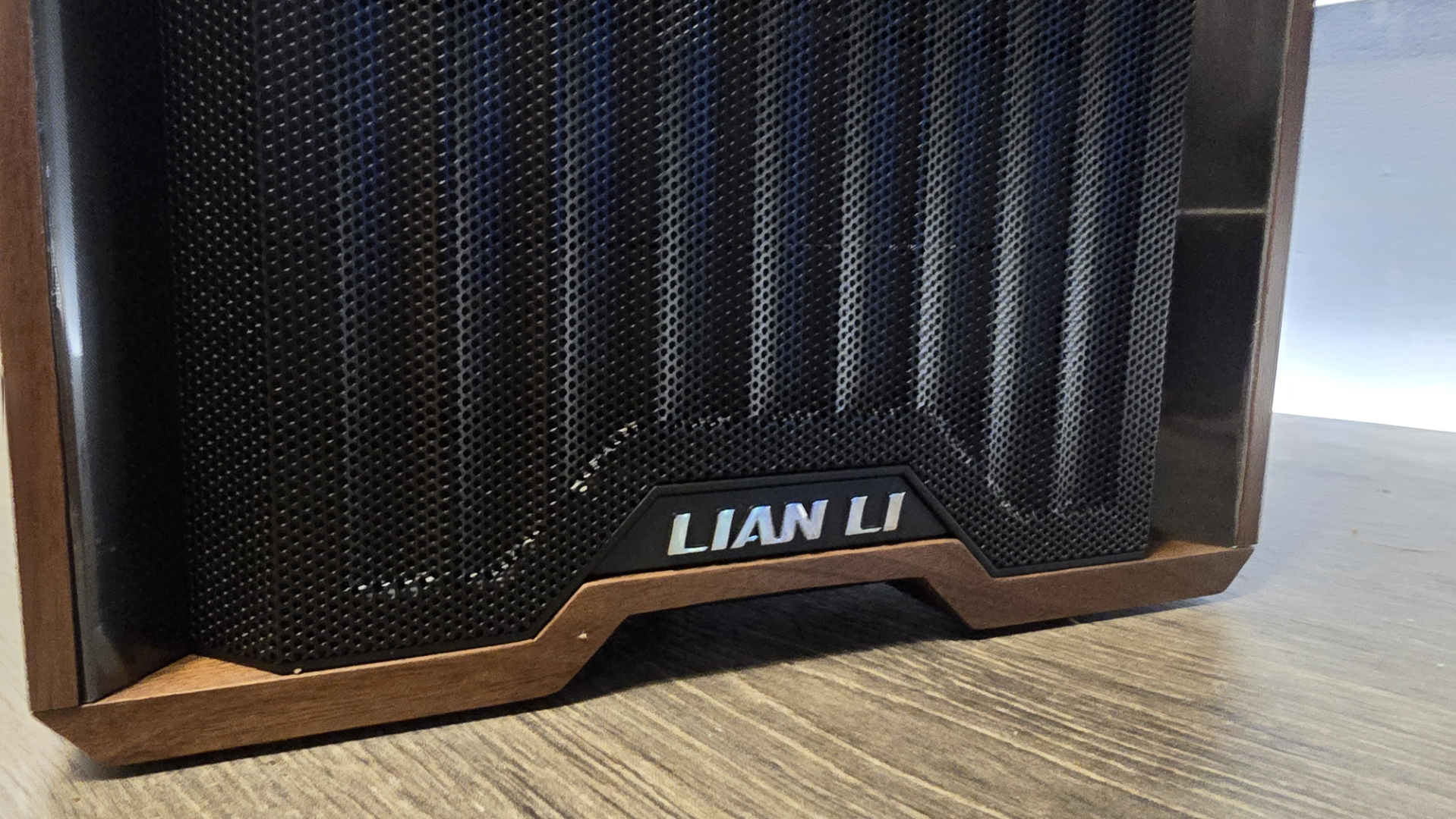 A Lian Li Lancool 217 on a desk with various components installed inside it.