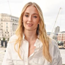 Sophie Turner styled a white shirt dress in London at a Hugo Spritz event.