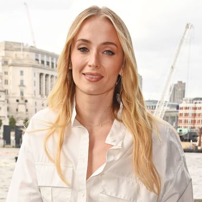 Sophie Turner styled a white shirt dress in London at a Hugo Spritz event.
