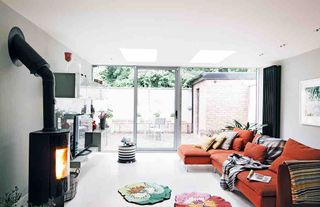 Living room sofa patio sliding glass doors wood brning stove skylights