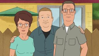 Bobby with his arms around Peggy (left) and Hank (right)