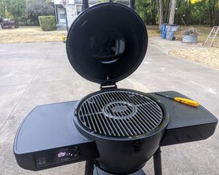 fully assembled kamado grill in a yard