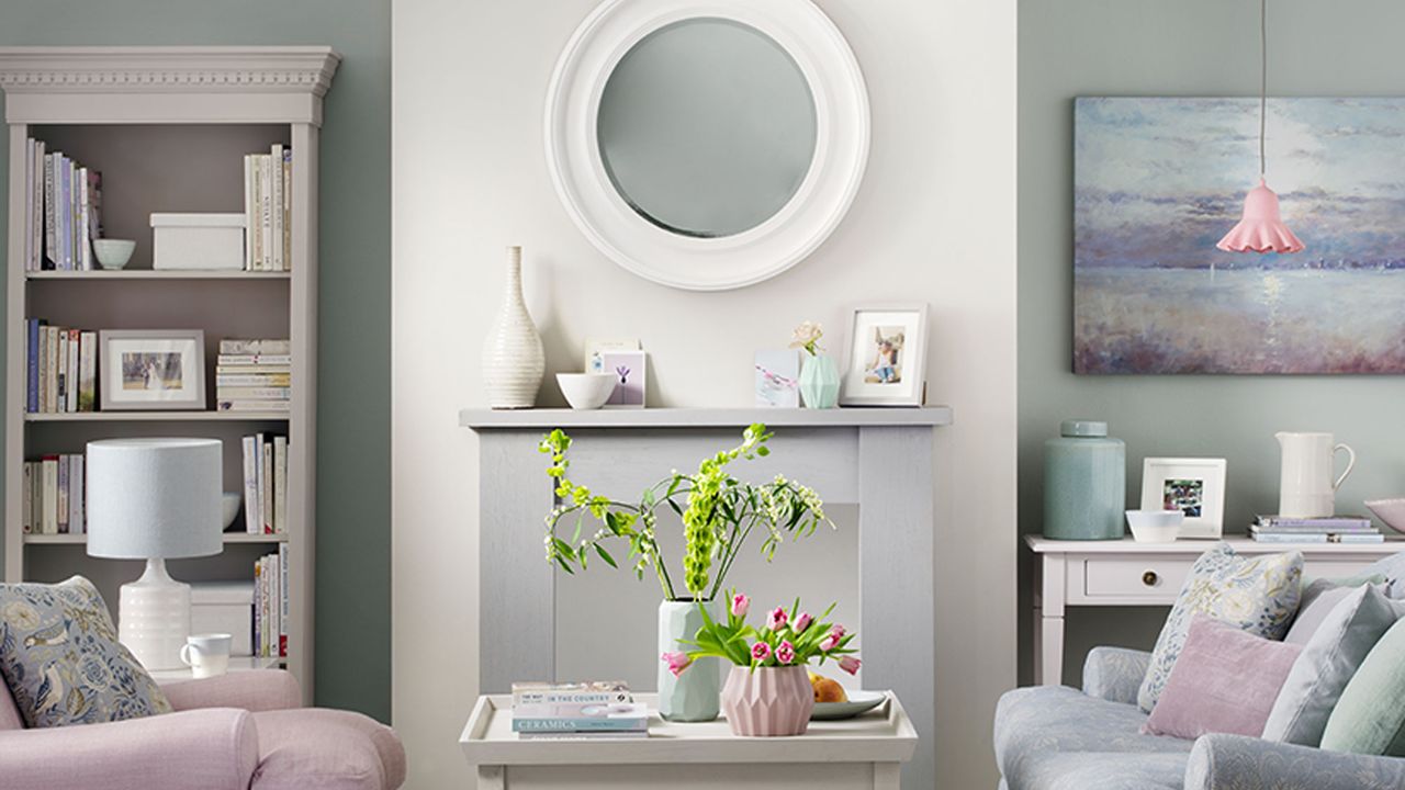 White and grey living room with pink sofa