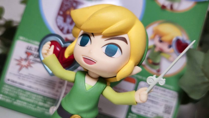 Close up of the Wind Waker Link nendoroid with a heart piece behind it.