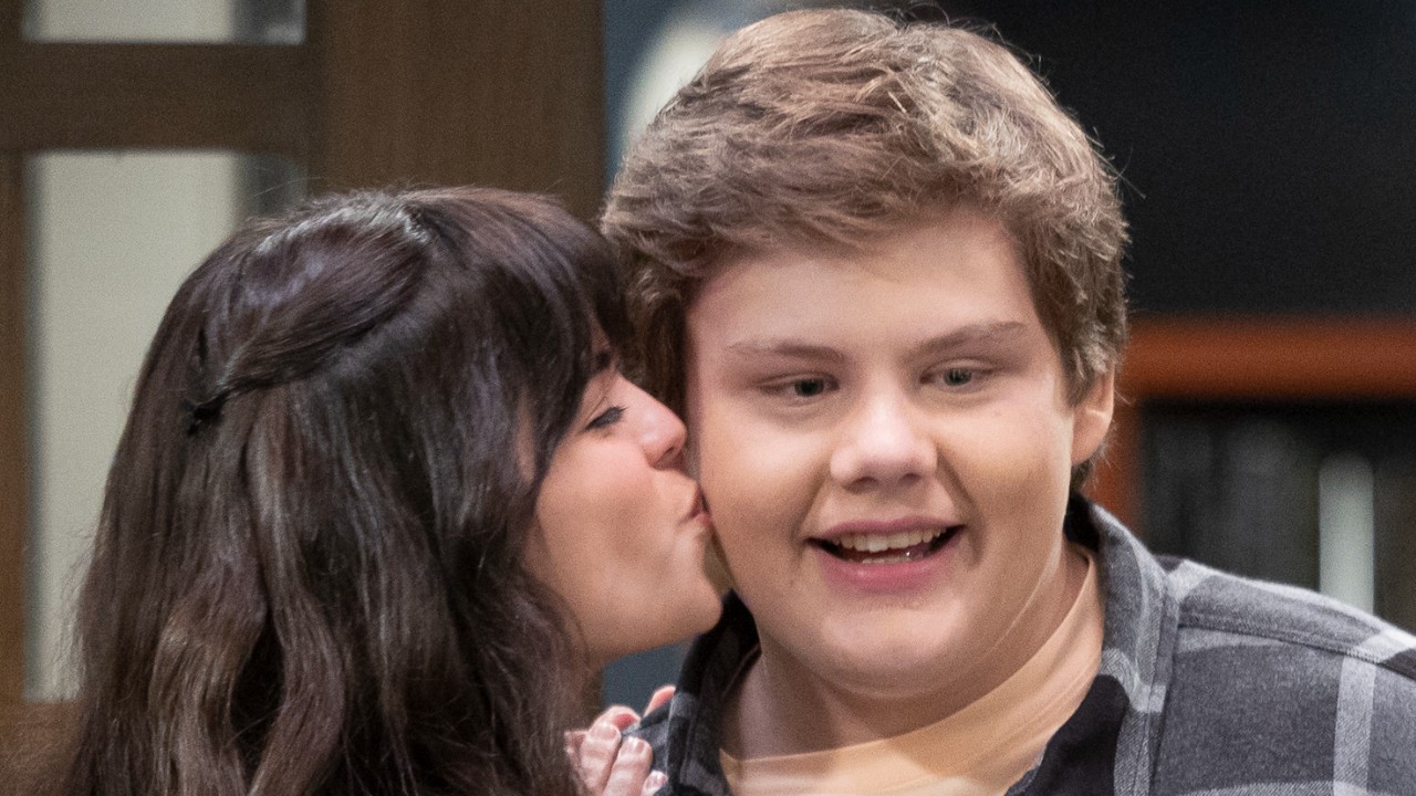 Carter getting a kiss from his girlfriend