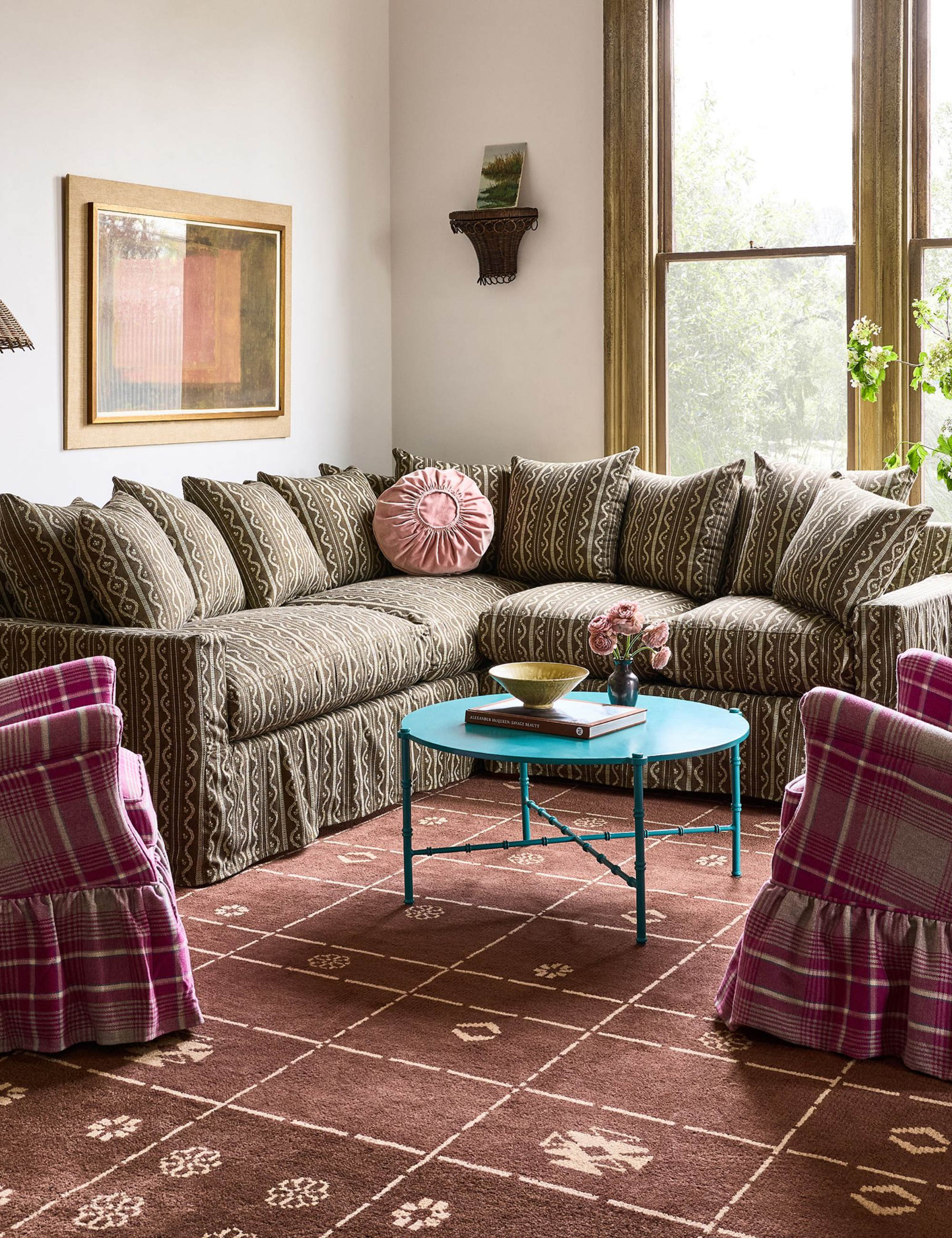 country style blue and white living room with floral slipcovered couch and matching arm chairs