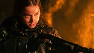 Eve (Ana de Armas) readies a flamethrower in a scene from "Ballerina"