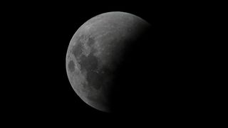 The moon is seen during a penumbral lunar eclipse in Buenos Aires, on May 15 2022.