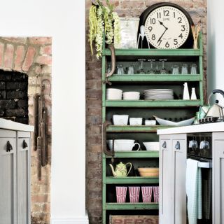 Green shelves in a rustic kitchen