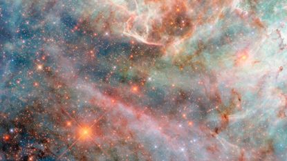 An image of the Large Magellanic Cloud with blue, purple, and pink hues