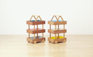 'Koloro' wagon, by Torafu Architects, for J Style. Two wooden three level toy storage trolleys.