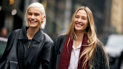 two women with blonde toned hair walking 