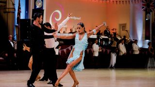 Darren Hammond in a black top and trousers and Marina Steshenko in a blue dress at the Blackpool Dance Festival in Blackpool's Dance Fever.