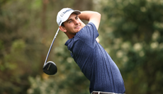 Mac Meissner hits a driver off the tee and watches its flight