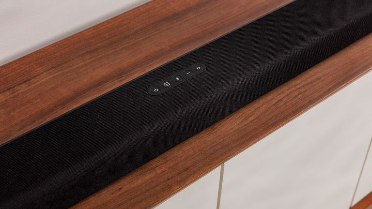 Polk Audio Signa S4 soundbar on wooden surface