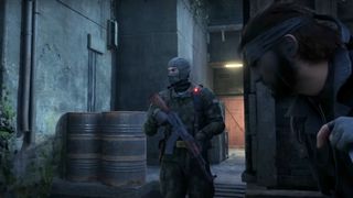 A screenshot of Snake hiding from a guard during the trailer for Metal Gear Solid Delta.