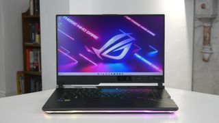Asus ROG Strix Scar 15 photographed on a table with its lid open, for a review