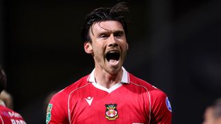 Kieffer Moore of Wrexham celebrates scoring his team's third goal during the Carabao Cup Second Round match between Preston North End and Wrexham at Deepdale on August 26, 2025 in Preston, England. 