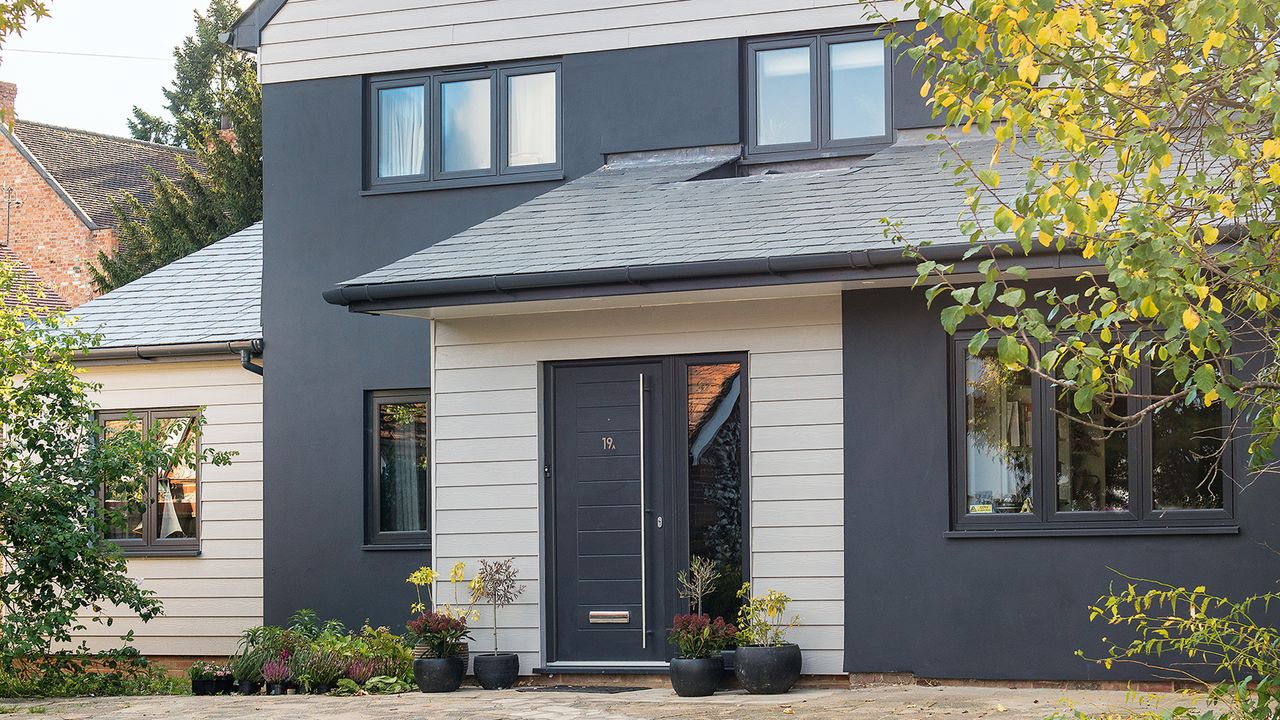 grey clad modern house with driveway