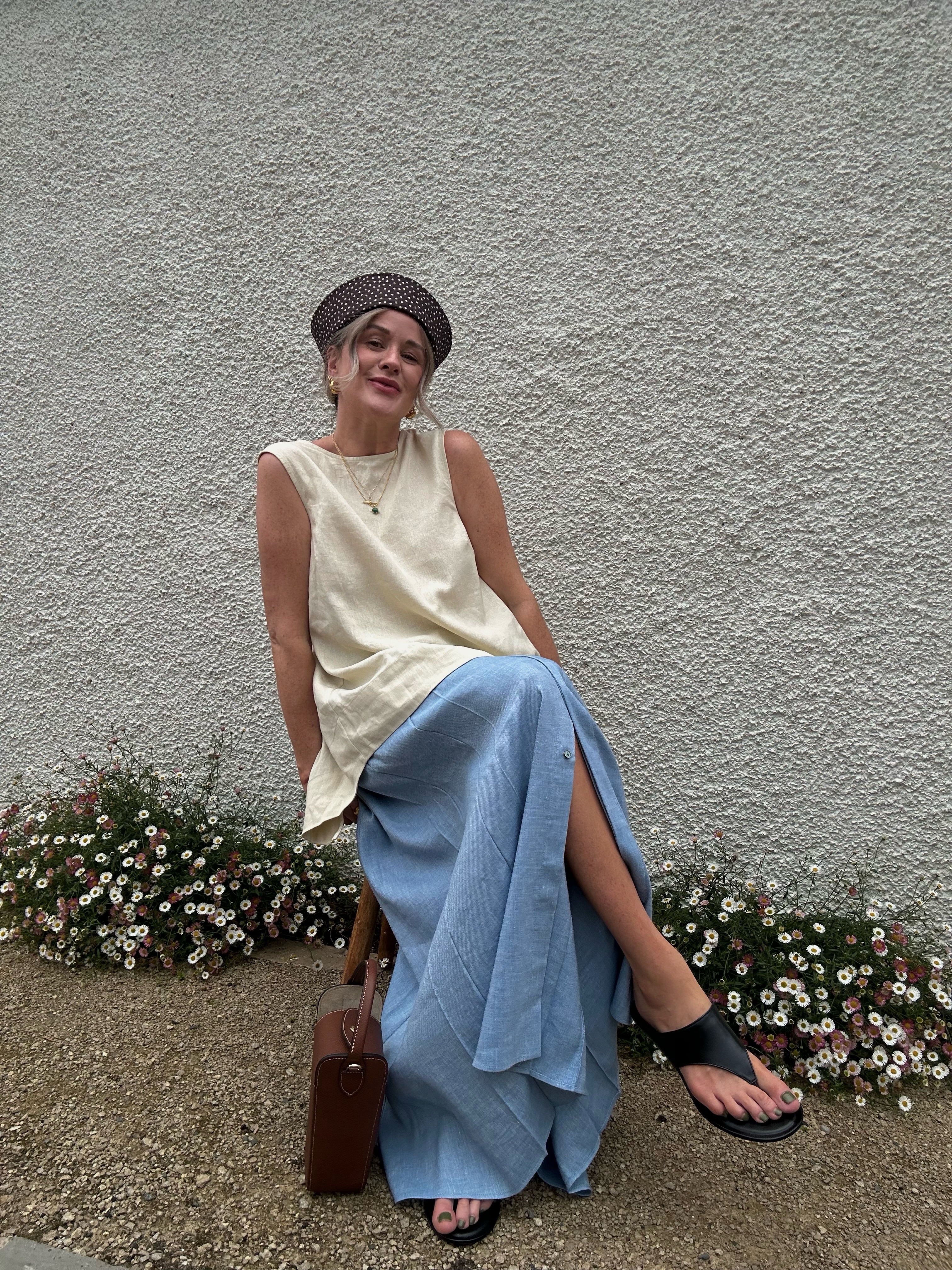 A woman wearing the thick-thong-sandal trend.