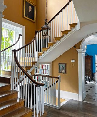 Yellow entryway and stairs with blue in the background