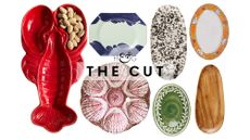 Stylish serving platters for summer, spanning styles including lobster motifs, clamshells, splatter paint, hand-painted botanical boarders, and solid acacia wood.
