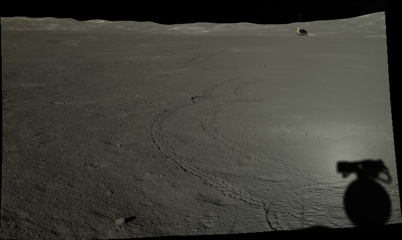 Yutu-2, casting a shadow, looks back toward the Chang'e-4 lander in July 2019.