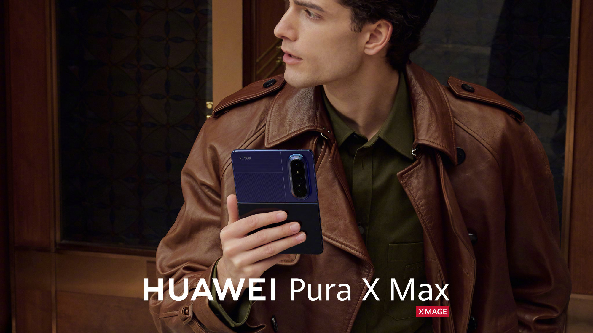 A man holding a blue Huawei Pura X Max