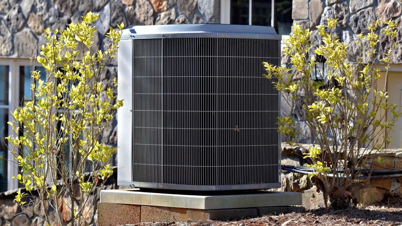 A large heat pump unit outside of a home