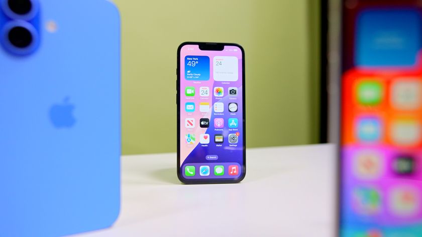 iPhone 16e on table with iPhone 16 and iPhone SE3