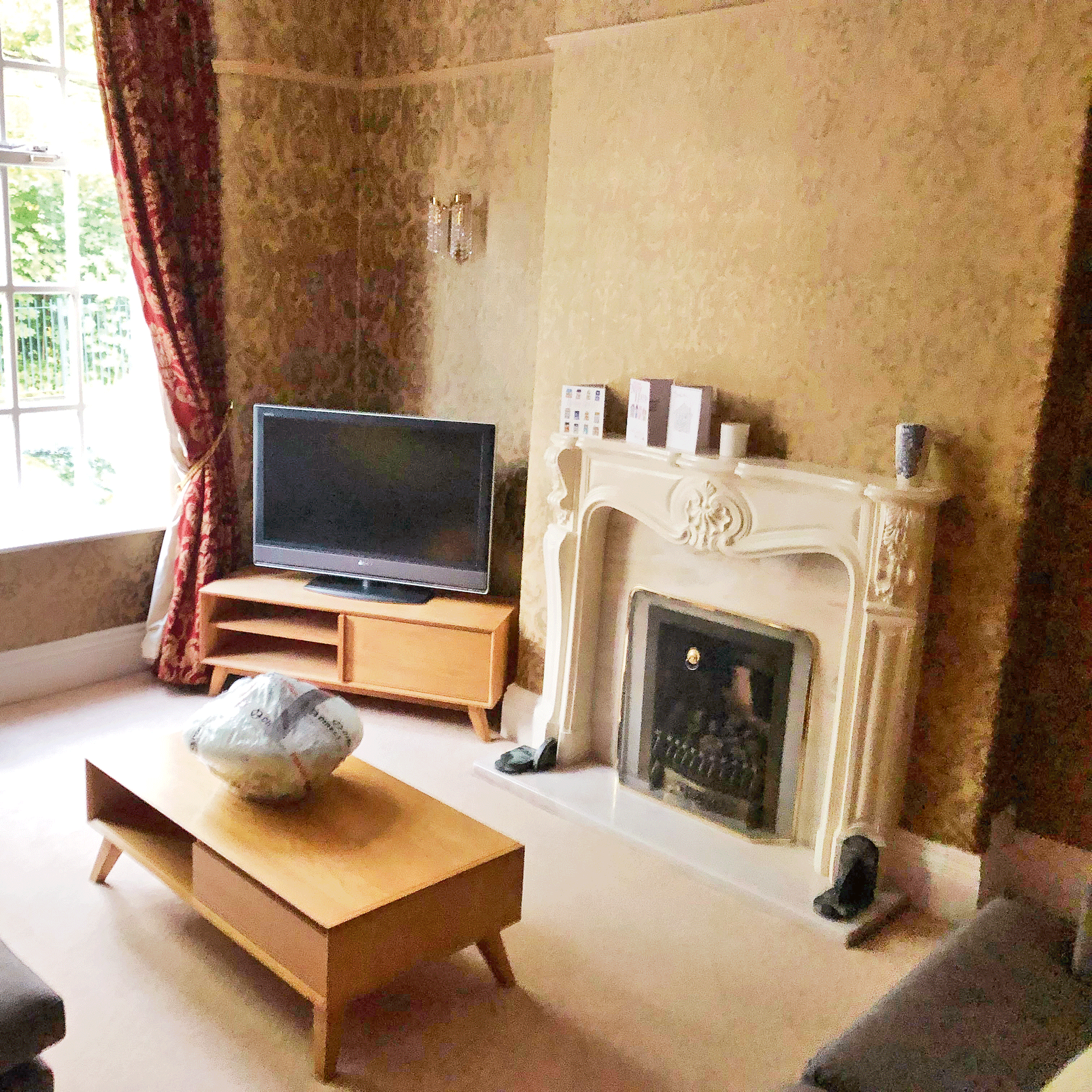 John Cooper's living room when he moved in, before he decorated