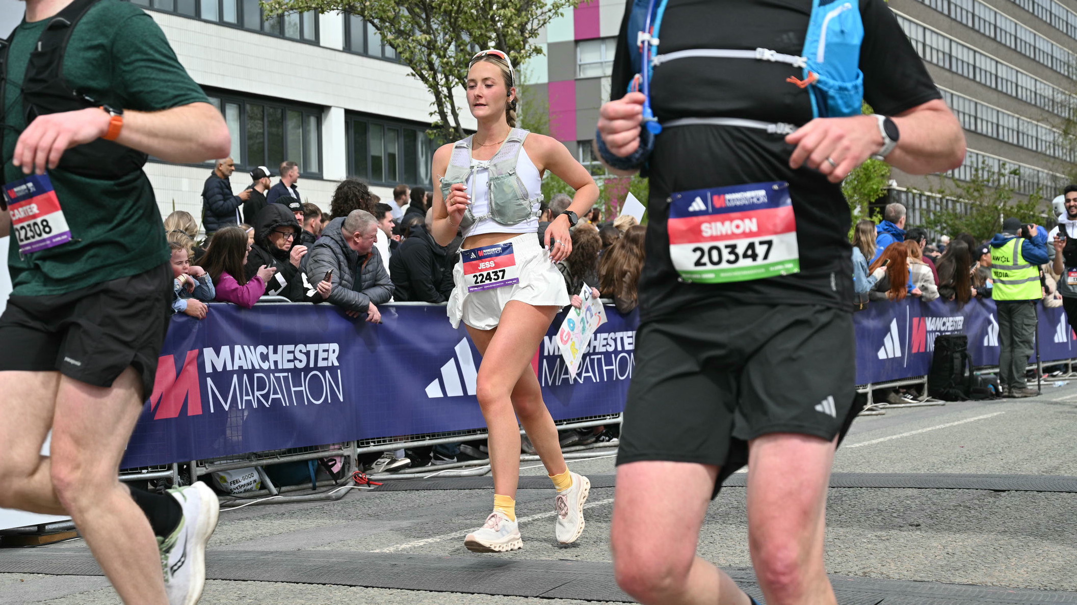 Writer Jessica crosses the Adidas Manchester Marathon wearing the Shokz OpenRun Pro headphones