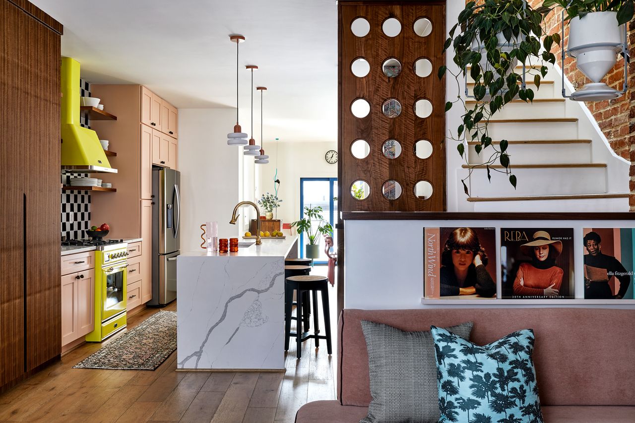 a kitchen with a checkerboard backsplash and neon yellow range cooker