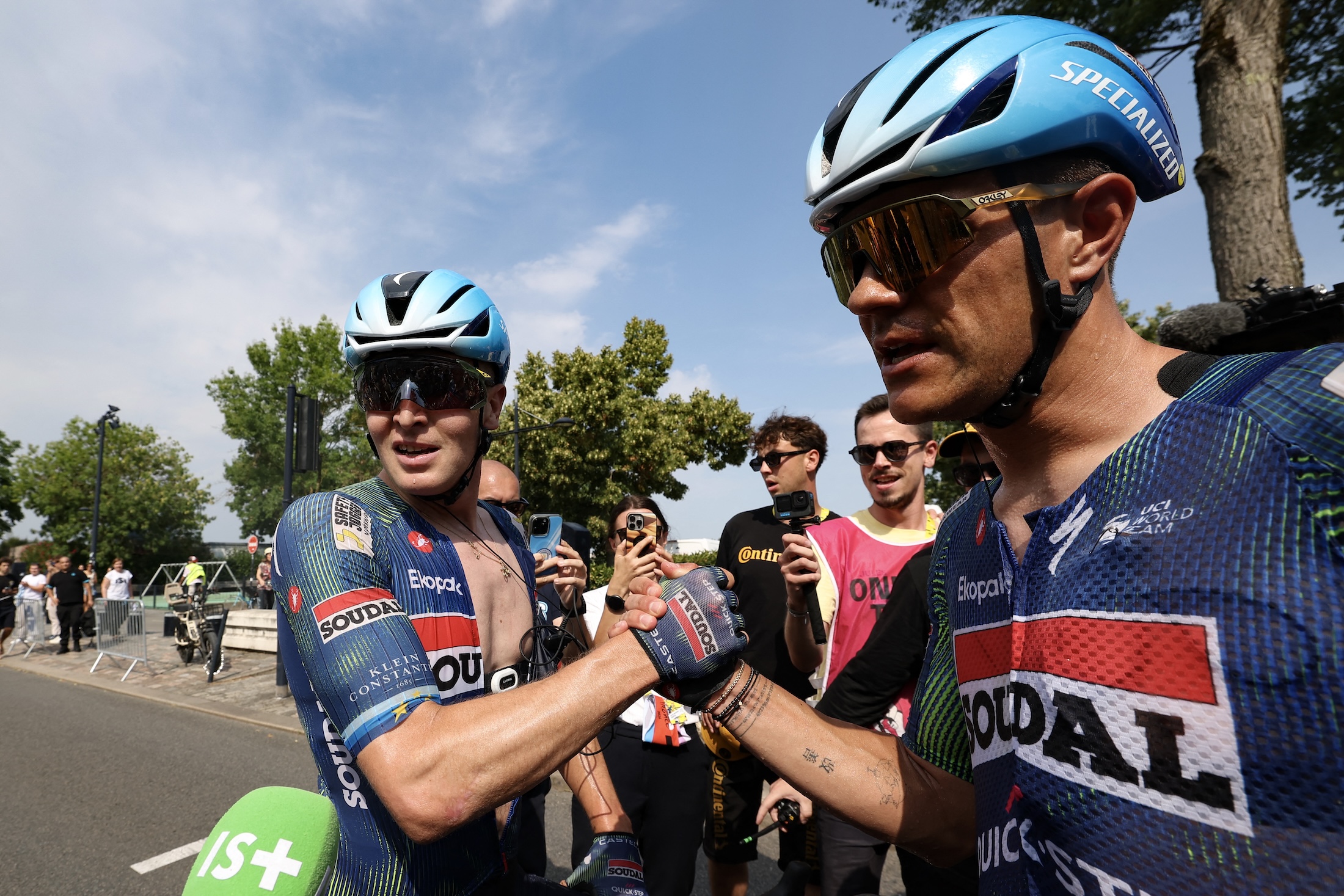 Soudal Quick-Step team's Belgian rider Tim Merlier (L) celebrates after winning the 7th stage of the 113th edition of the Tour de France