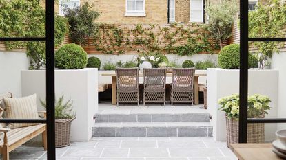 small garden design mistakes – tiered plot with paving