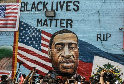  A mural painted by artist Kenny Altidor depicting George Floyd is unveiled on a sidewall of CTown Supermarket on July 13, 2020 in the Brooklyn borough New York City.