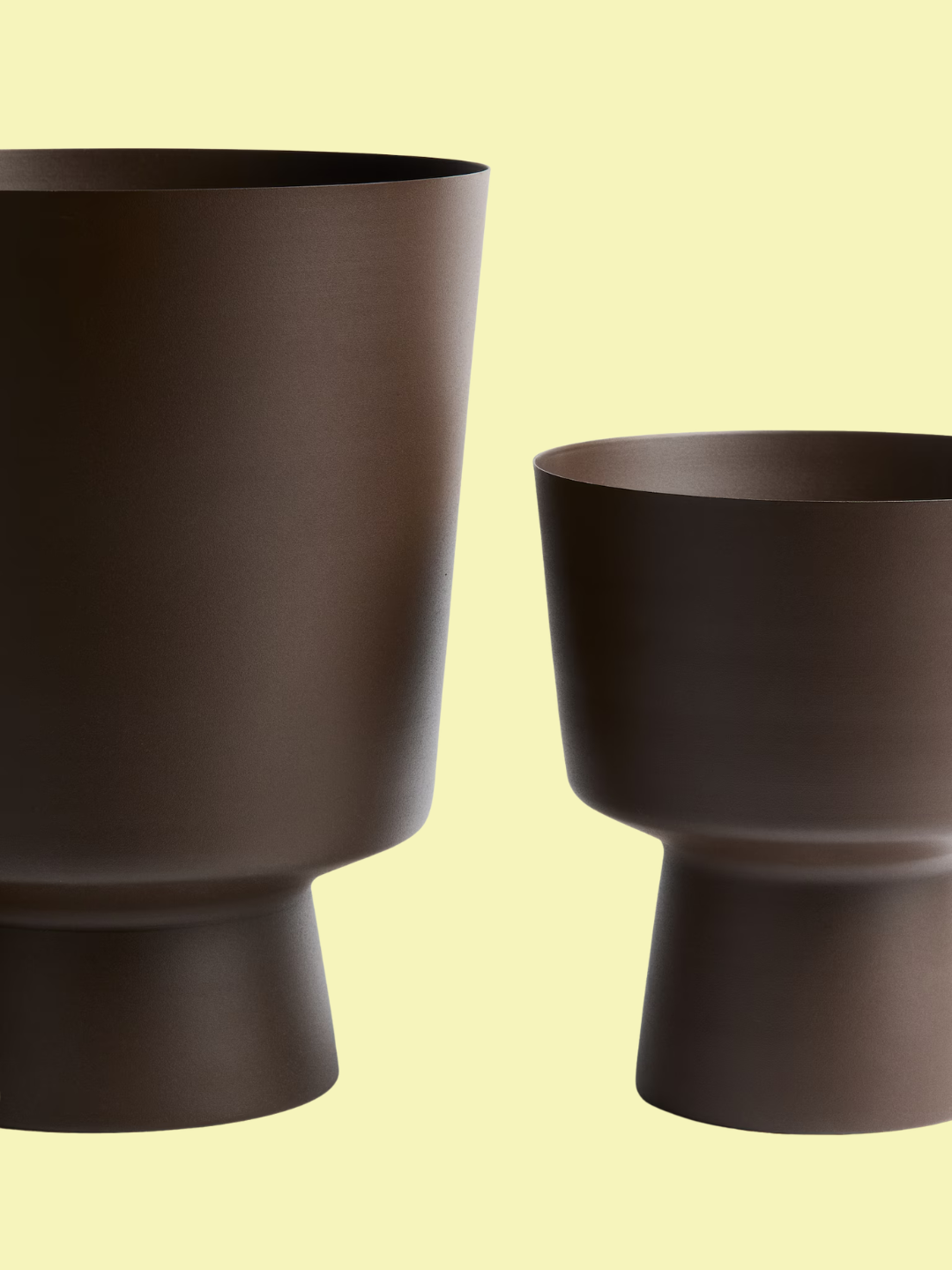 A brown metal outdoor plant pot