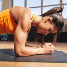 A woman trying various plank variations