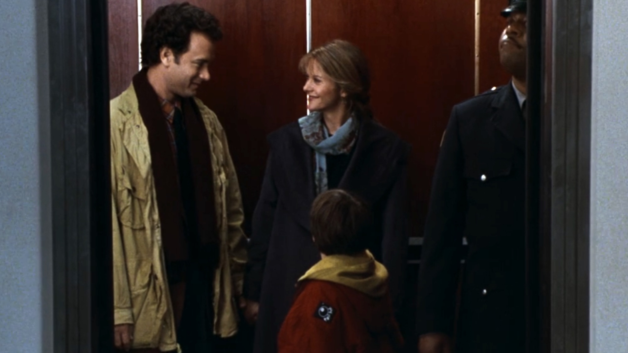 Sam, Annie and Jonah in the elevator in Sleepless in Seattle