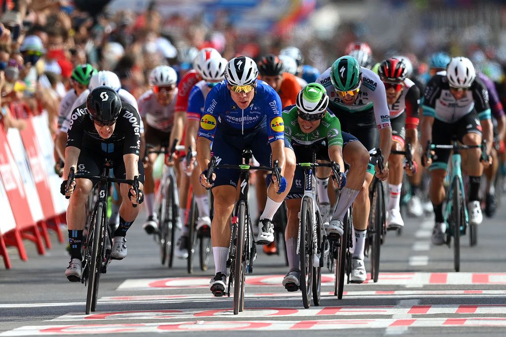 LA MANGA SPAIN AUGUST 21 Fabio Jakobsen of Netherlands and Team Deceuninck QuickStep sprints to win ahead of Alberto Dainese of Italy and Team DSM and Jasper Philipsen of Belgium and Team AlpecinFenix green points jersey during the 76th Tour of Spain 2021 Stage 8 a 1737 km stage from Santa Pola to La Manga del Mar Menor lavuelta LaVuelta21 on August 21 2021 in La Manga Spain Photo by Stuart FranklinGetty Images