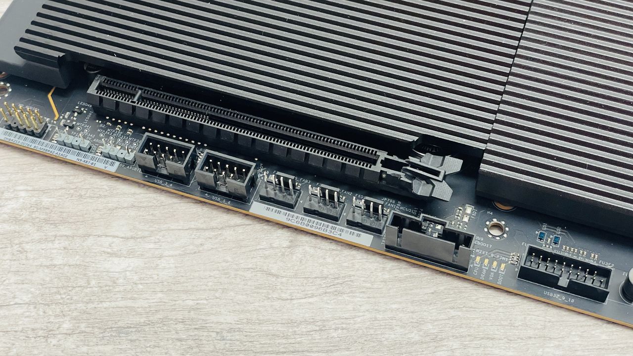An NZXT N9 X870E motherboard in black with the port covers removed.