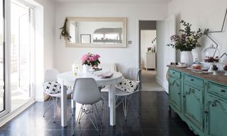 kitchen diner with white table and chairs